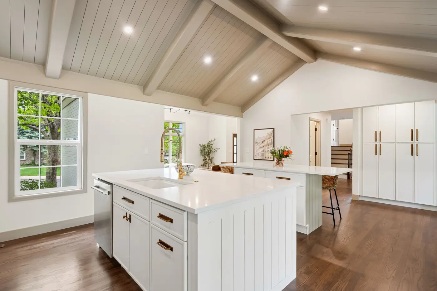 Range and wood hood in a white kitchen
