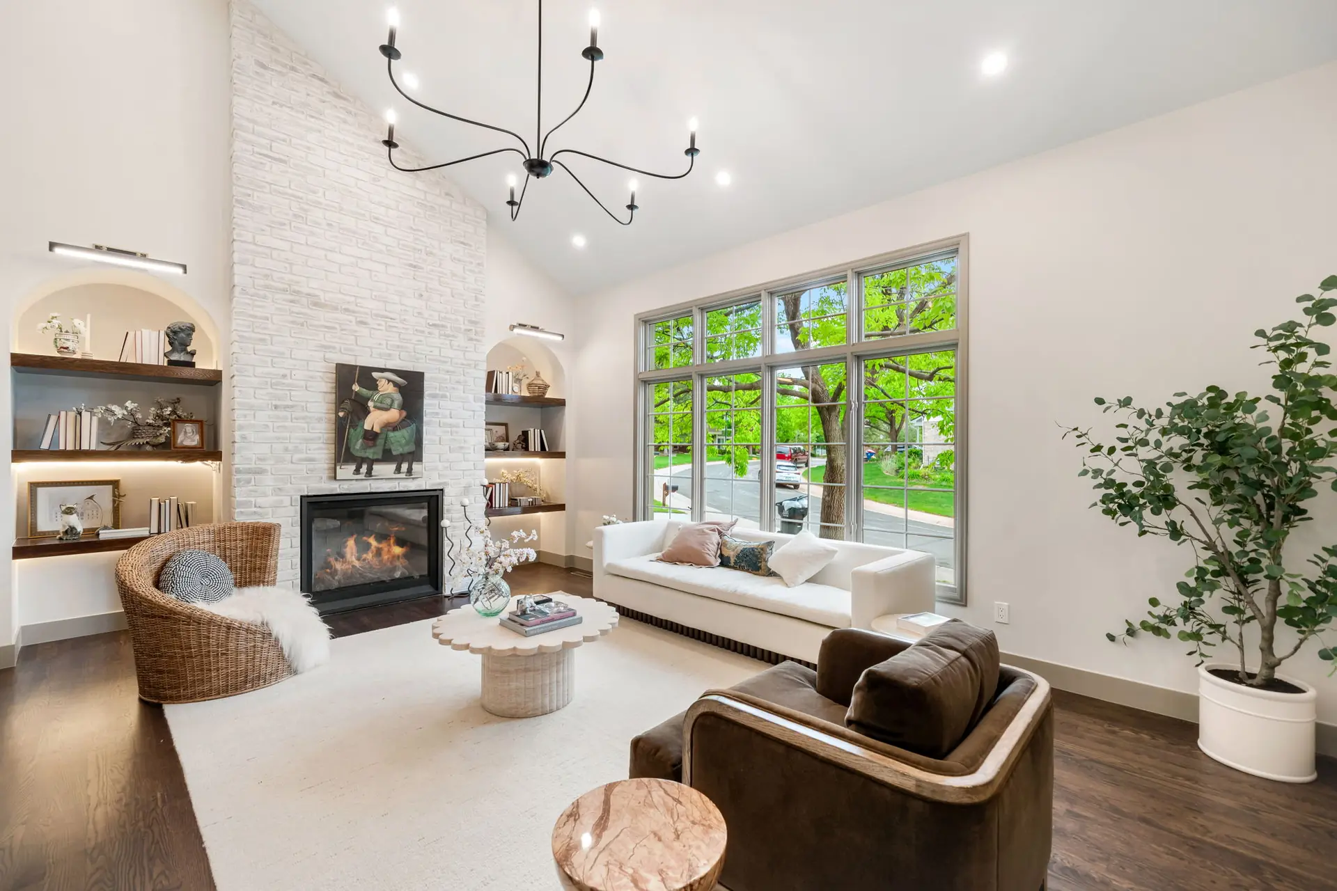 Living room with a stone fireplace and wood beams