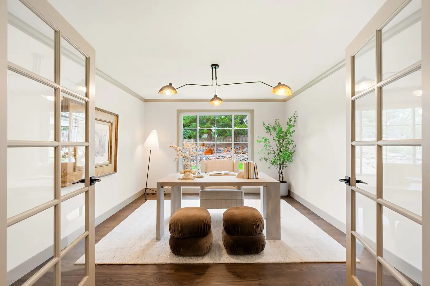 Home office with built-in shelves and a wood desk